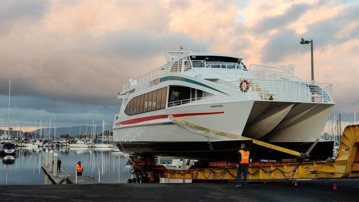 Workers for All American Marine prepare to launch a 73-foot catamaran into Squalicum Harbor on Monday, April 2. The boat will be used by Puget Sound Express of Port Townsend for whale watching expeditions in the area.