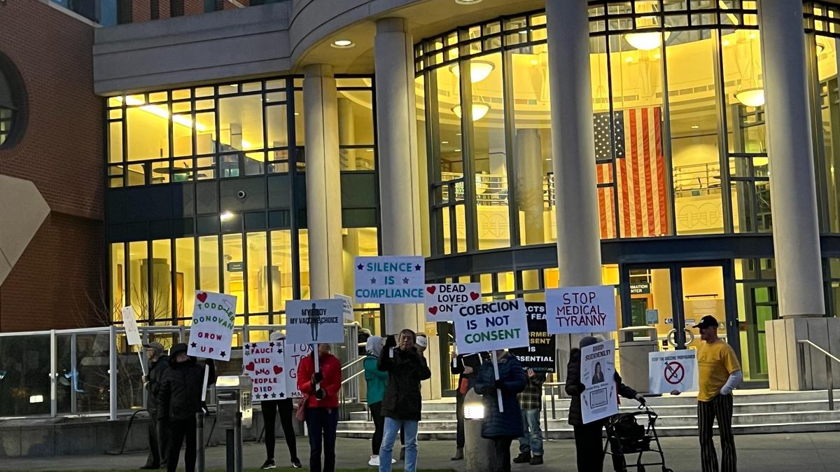 Protesters demonstrate about issues related to COVID-19 outside the Whatcom County Courthouse before a County Council meeting on Feb. 7, 2023.