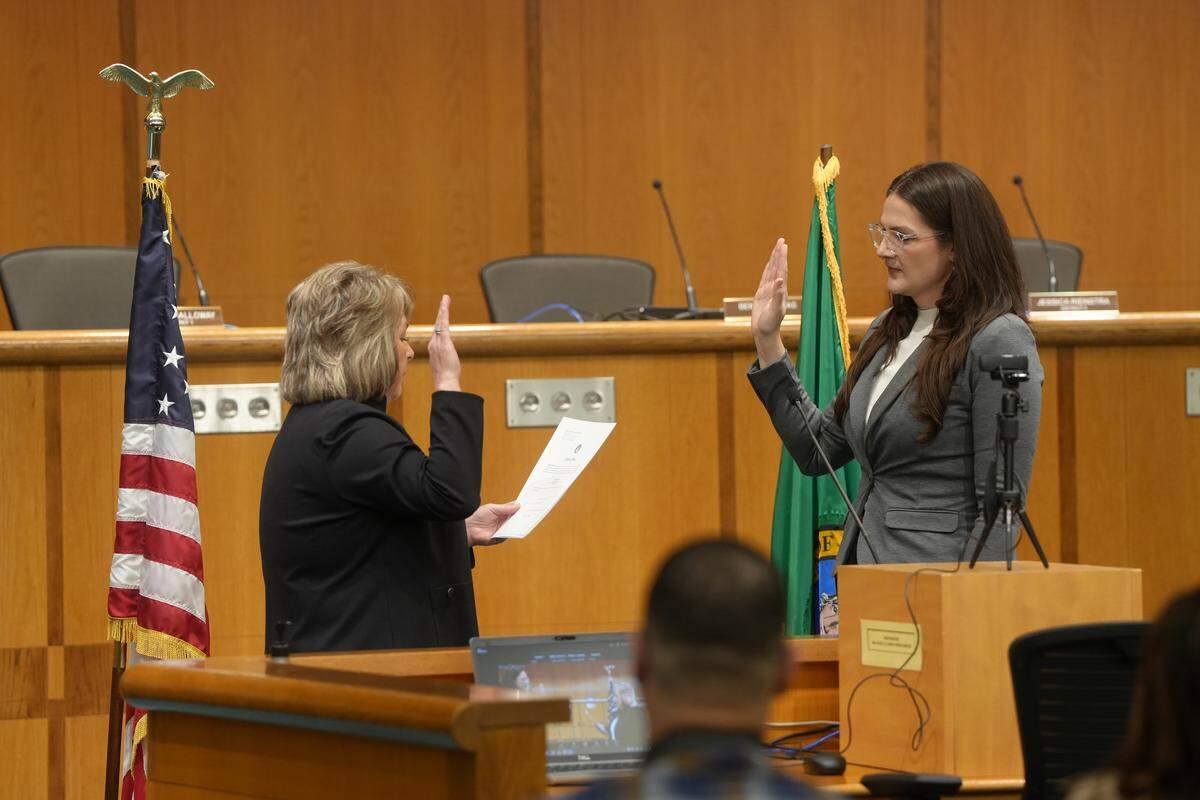Whatcom County Council member Jessica Rienstra (right) participates in the oath of office ceremony Jan. 12.