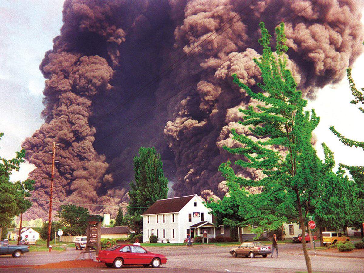 Smoke billows from the June 10, 1999, pipeline explosion along Whatcom Creek in Bellingham, Wash, that killed three people. Photographer Angela Lee Holstrom, who worked at SAS Brokerage, was standing at the corner of James and Virginia streets.