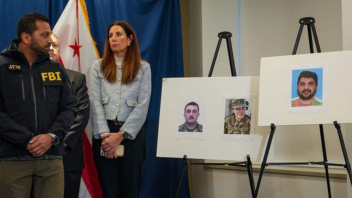 WASHINGTON, DC - NOVEMBER 27: FBI Director Kash Patel (L) looks at photos of the two West Virginia National Guard soldiers shot in Washington, D.C., along with the suspect in the shooting on November 27, 2025 in Washington, DC. Two members of the West Virginia National Guard were shot blocks from the White House in what authorities are calling a targeted shooting. (Photo by Andrew Leyden/Getty Images)