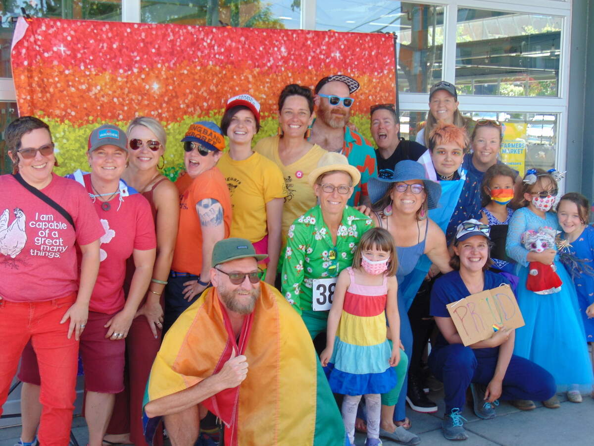 Participants pose for a rainbow photo at the Whatcom Pride parade Sunday, July 11, 2021, in Bellingham, Wash.