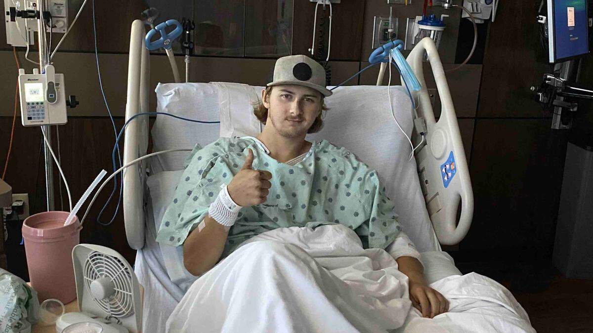 Carson Moyes recovers in a bed at St. Joseph hospital in Bellingham after he and a Whatcom County Public Works coworker were injured after being struck by an SUV while they were cutting grass along the shoulder of Lummi Shore Road Tuesday, July 20.