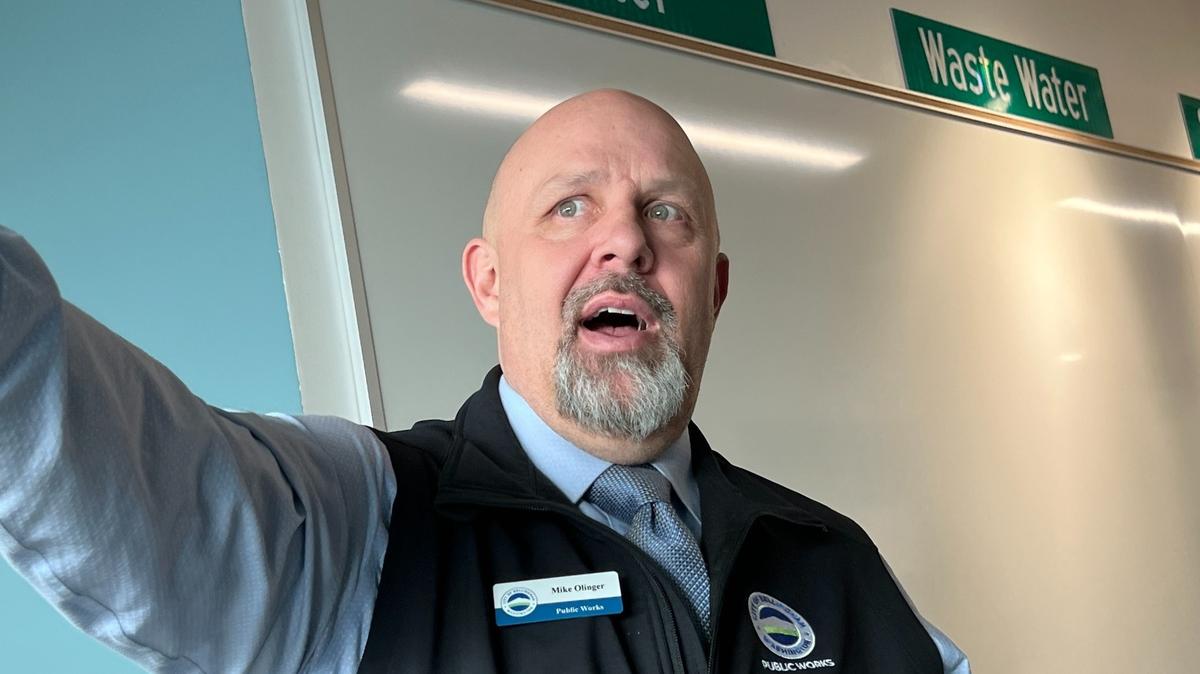 Mike Olinger, assistant director of the Bellingham Public Works Department’s Operations Division, leads a tour Wednesday, March 1, of the city’s new Operations Center. Olinger is standing in front of a “job board” where daily assignments for various city crews will be posted.