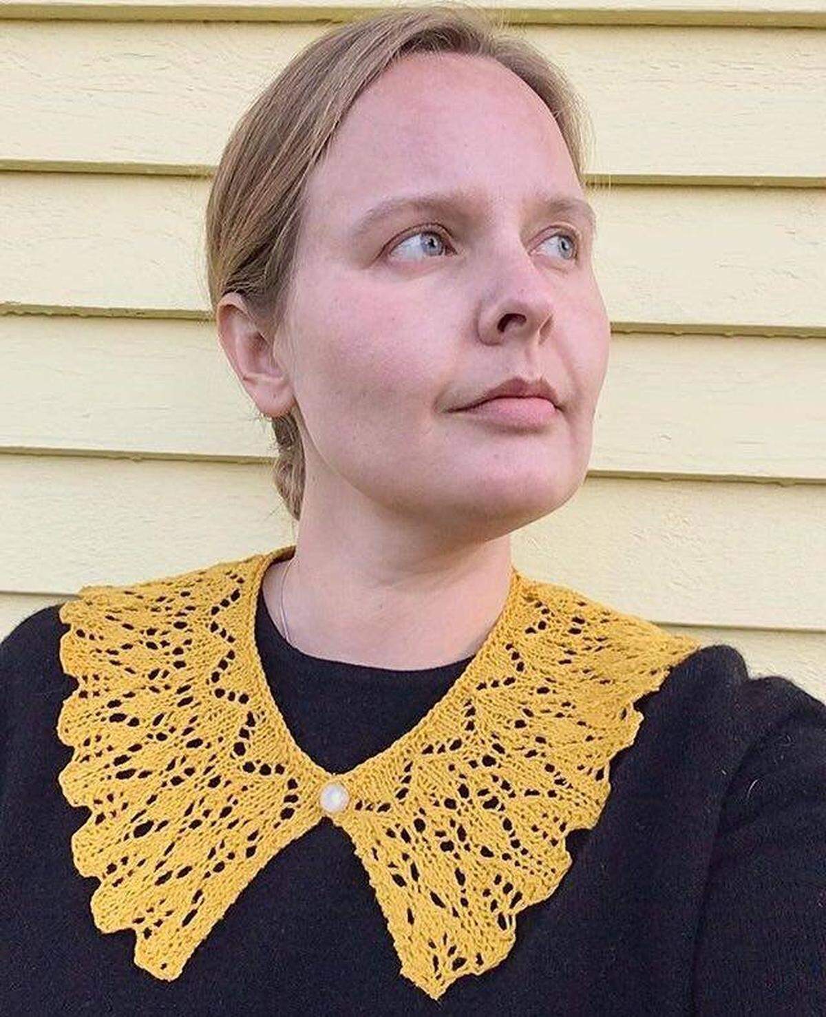 Eowyn Savela models a fancy collar that she and other members of the Riveters Collective made and sent to U.S. Supreme Court Justice Ruth Bader Ginsburg.