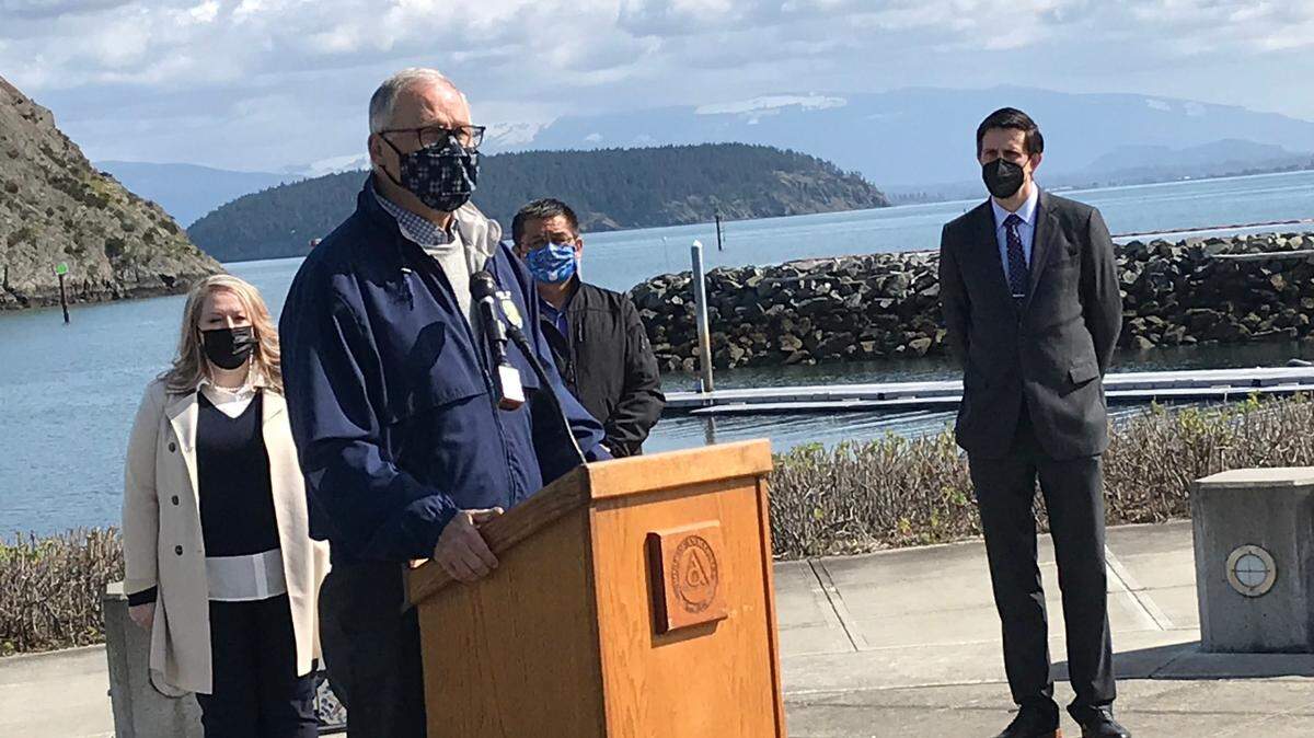 Washington Gov. Jay Inslee urges the passage of House Bill 1091 and Senate Bill 5126, which would address the increasing effects of climate change, Tuesday, March 30, at Seafarers’ Memorial Park in Anacortes, Wash.
