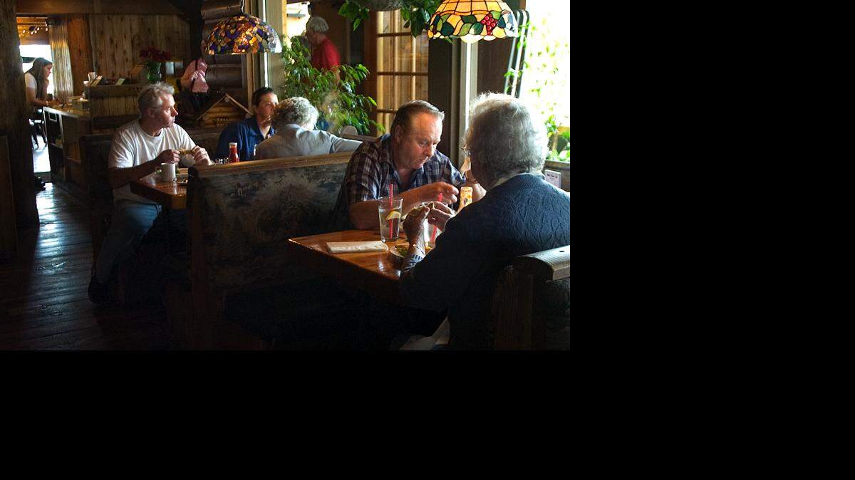The Sumas Bob’s Burger and Brew, 819 Cherry St., is nestled in a log cabin-type building with a hotel, Sumas Mountain Lodge, above. Employee Mandy Visser says the workers and customers get along well because of the intimate atmosphere and the restaurant’s prominence in the small town.