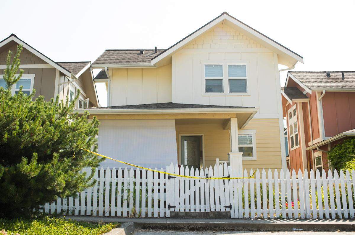 Crime scene tape blocks the entrance of a Happy Valley home  where Frances Gregory lived with her son Matthew Gregory. He is charged with one count of second-degree murder for the death of his 64-year-old mother.