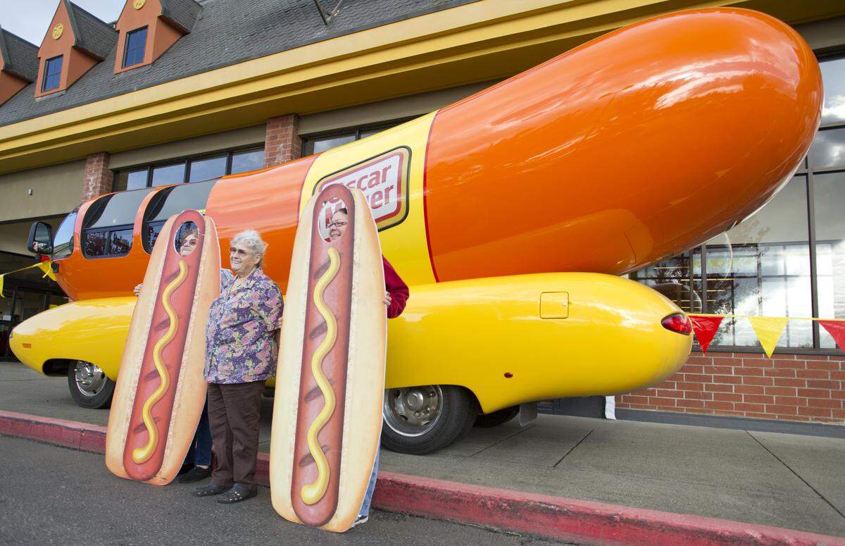 Mary Joyce, left, Janet Cooper, center, and Sundee Joyce, right, pose for a photo in front of the Wienermobile in 2013 at the Lynden Food Pavilion.