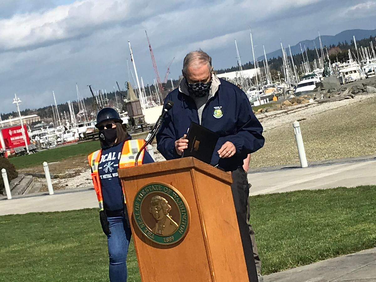 Washington Gov. Jay Inslee urges the passage of House Bill 1091 and Senate Bill 5126, which would address the increasing effects of climate change, Tuesday, March 30, at Seafarers’ Memorial Park in Anacortes, Wash.