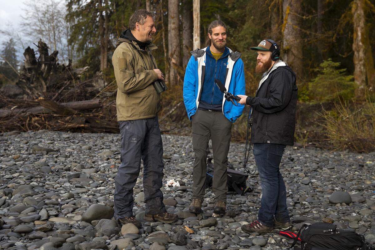 Chris Morgan, left, Matt Mikkelsen and Matt Martin record an episode of “THE WILD With Chis Morgan” while hiking to an area called One Square Inch of Silence on April 5, 2019, in the Hoh Rainforest on the Olympic Peninsula.