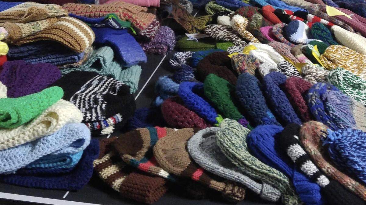 Some of the estimated 1,500 hats and scarves that volunteers throughout Whatcom County knit or crochet for those who need them as part of Interfaith Coalition’s Project Warm-Up.