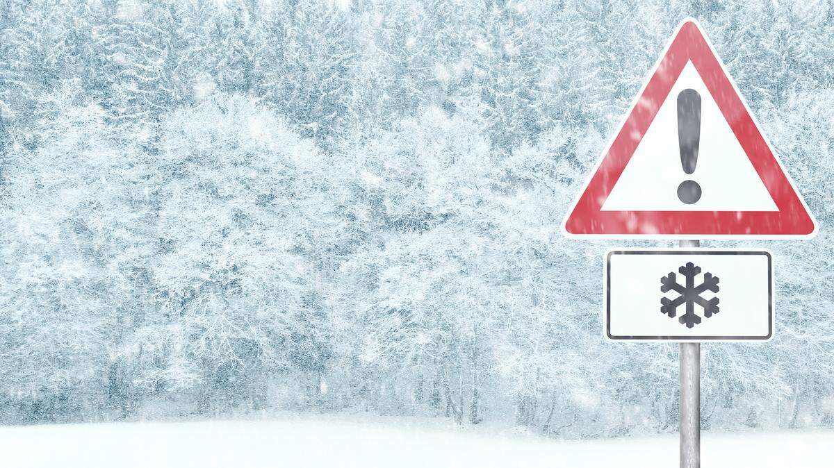 Snowy landscape with warning sign stock image.