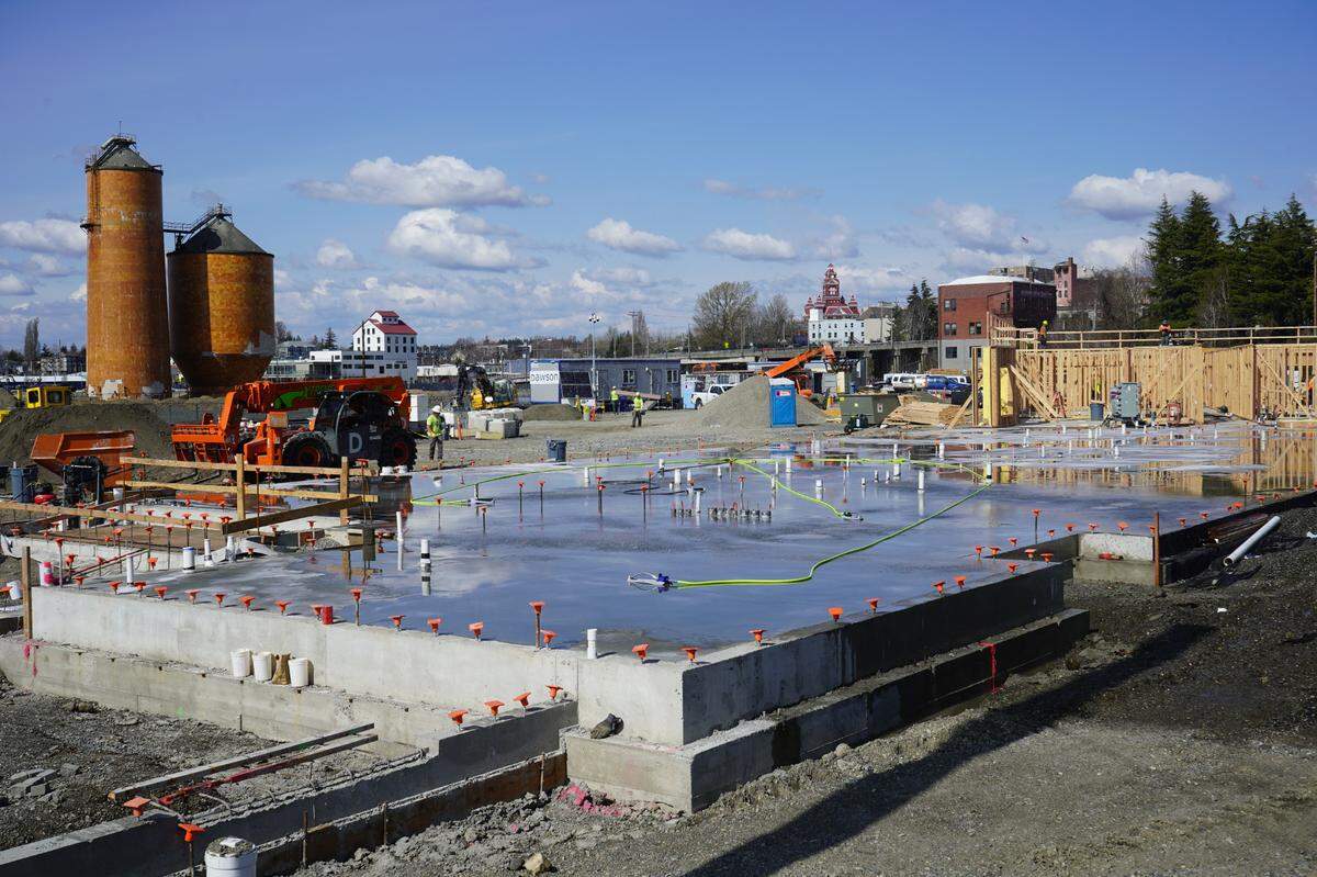 Construction of phase I of The Millworks Family Housing project, an affordable development, continues on Friday, April 14, 2023, in Bellingham, Wash. The site was used for decades as storage for paper mill byproducts.