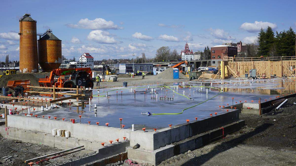 Construction of phase I of The Millworks Family Housing project continues on Friday, April 14, in Bellingham. The site was used for decades as storage for paper mill byproducts.