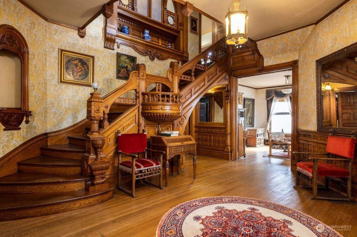 The original woodworking still adorns the grand staircase and entryway of the Clark Mansion in Bellingham.