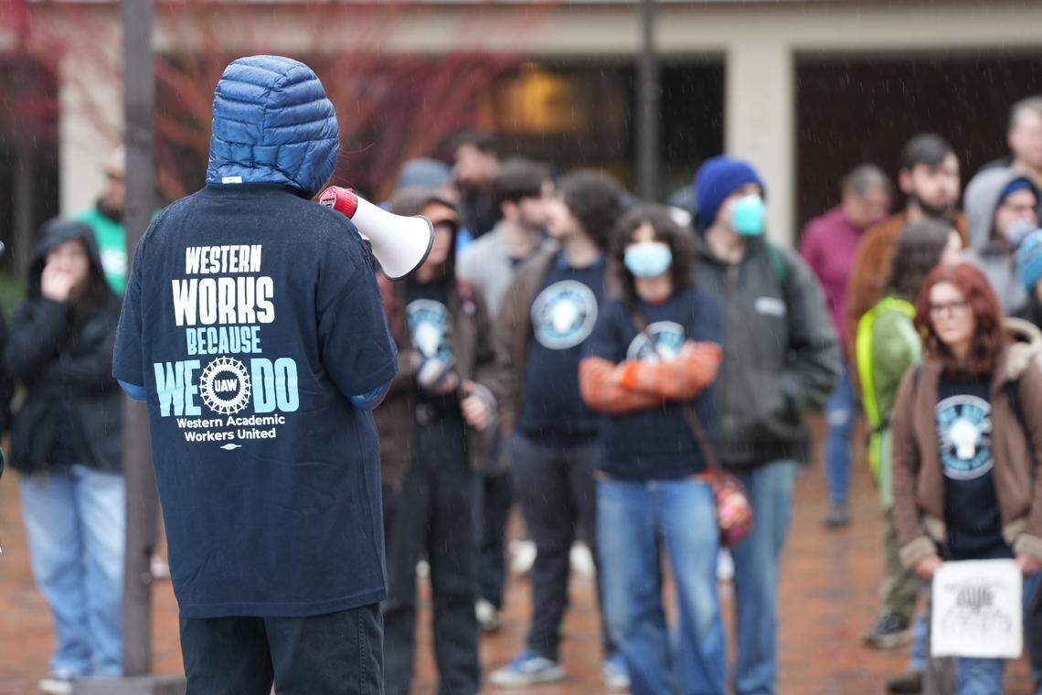 An organizer speaks to a crowd of more than 100 Western Washington University students and staff protesting proposed budget cuts.