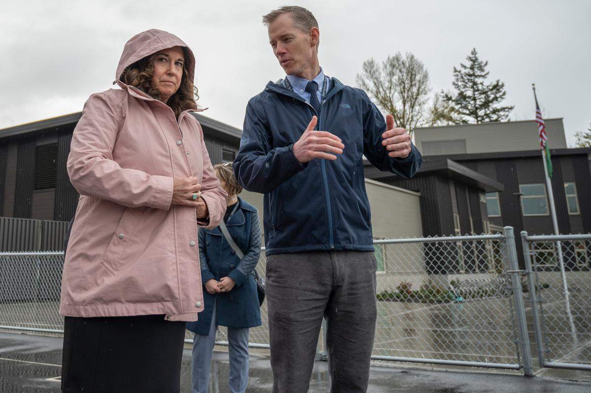 Alderwood Elementary School Principal Micha Smith, right, tells U.S. Deputy Secretary of Education Cindy Marten how American Rescue Plan dollars are being used for education on Tuesday, April 19, in Bellingham.