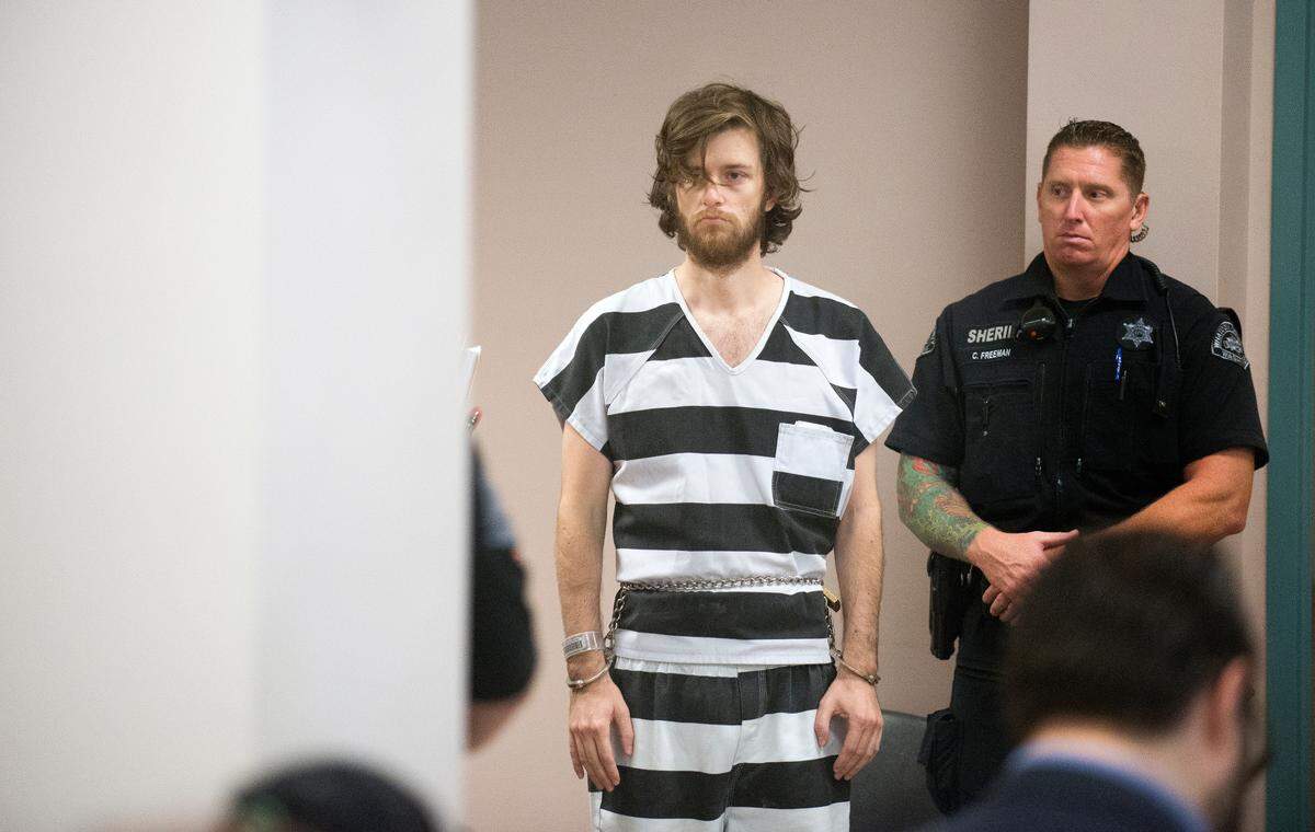 Matthew Gregory, left, appears in Whatcom County Superior Court at his competency hearing on Thursday, Aug. 23, 2018. in Bellingham, Wash. Gregory is charged with one count of second-degree murder in the death of his mother Francis Gregory.