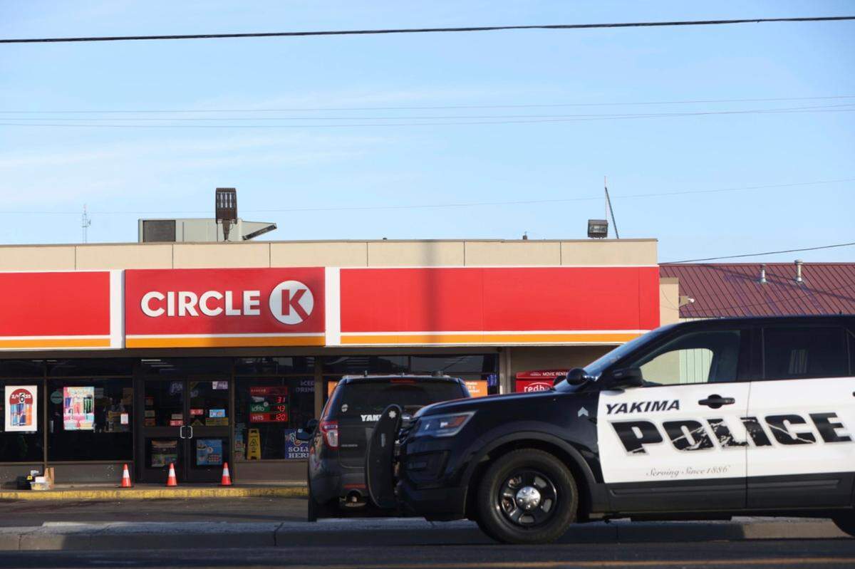 Police cordon off the area around a Circle K convenience store on Nob Hill Boulevard in Yakima, Wash., on Tuesday, Jan. 24, where people were fatally shot in the early morning.