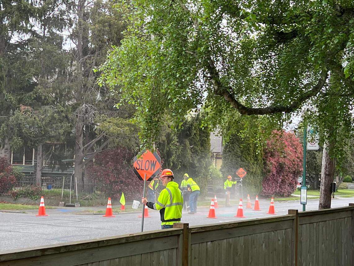 A Bellingham Public Works crew removes crosswalk markings made by neighbors on Eldridge Avenue in Bellingham on May 9.