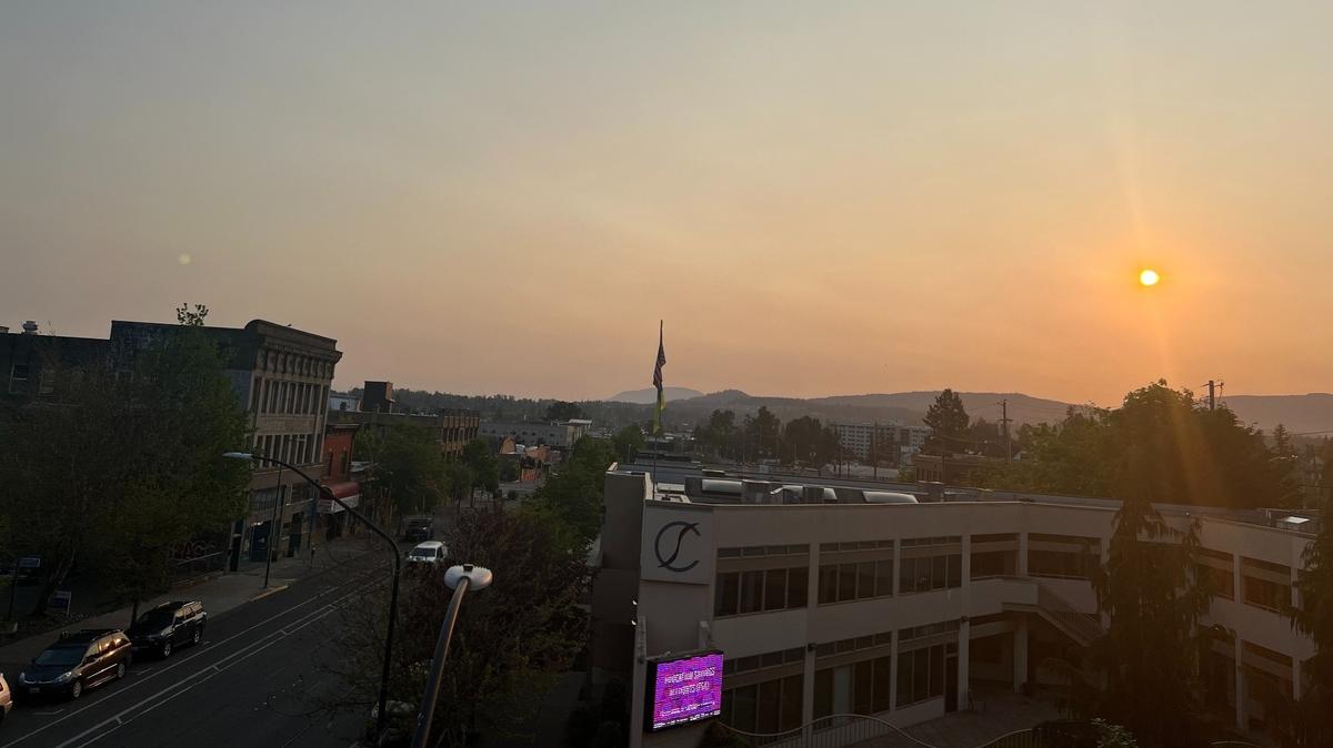 WIldfire smoke in the upper atmosphere causes a hazy sunrise over downtown Bellingham in 2023.