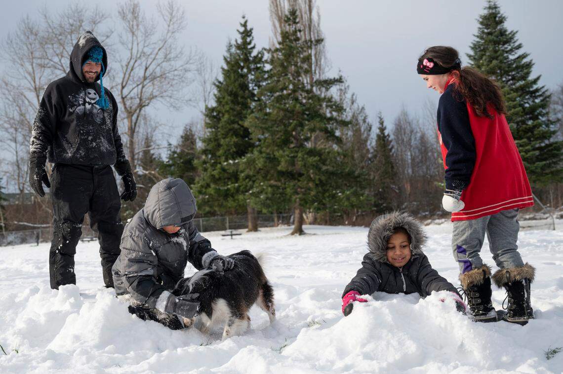 The Pierce family plays in the snow on Wednesday, Dec. 29, in Bellingham.