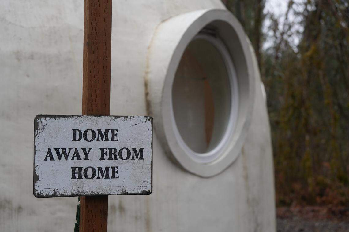 A sign that reads “Dome Away From Home” is posted outside a porthole window on the Skyview Dome.