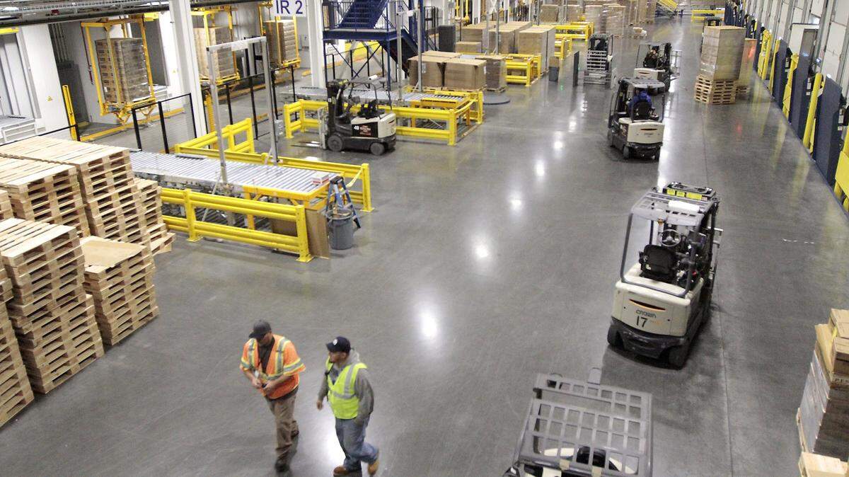 Employees and forklifts move about in the receiving bay area of the new Preferred Freezer Services facility in Richland. Bellingham Cold Storage is hosting a career fair on Friday and Saturday as it plans to hire around 30 forklift operators.
