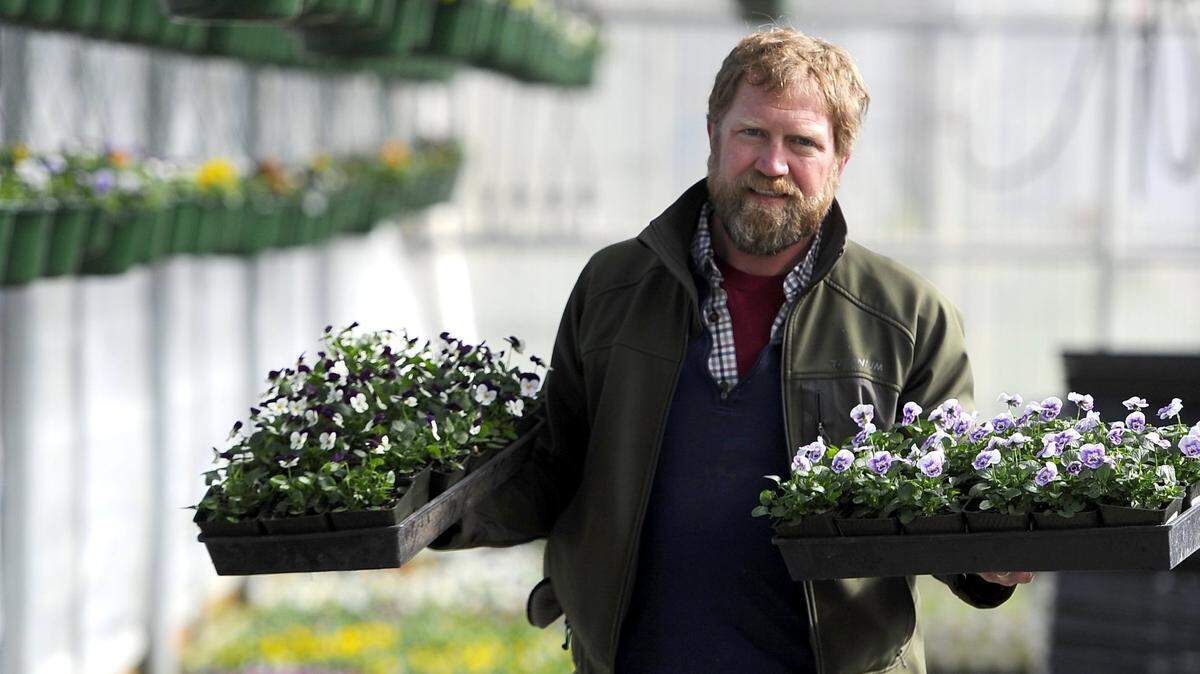 Owner Nathan Weston fills an order at Joe’s Garden in Bellingham in 2015. “Weather permitting we will open mid-February which we have done for a handful of seasons in the past. At this time we plan to open in March, but if the weather warms or dries out, we may move that up,” Weston said this week.