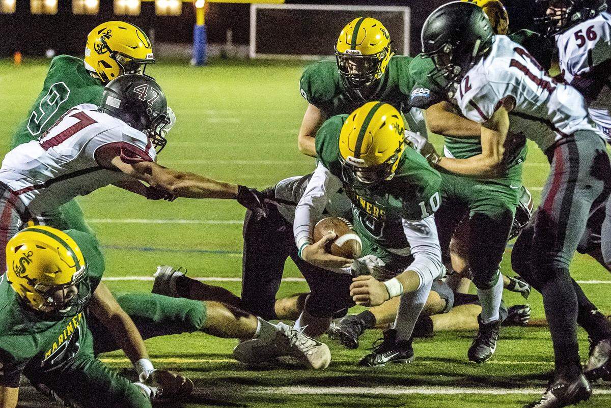 Sehome quarterback Jacob Kaepernick (10) breaks through the line of scrimmage to score a touchdown during the second quarter at Civic Stadium on Friday evening Oct. 11, 2019, in Bellingham, Wash. The score and resulting extra point gave Sehome a 21-14 lead to help defeat Cedarcrest 35-14. (Paul Conrad for the Bellingham Herald)