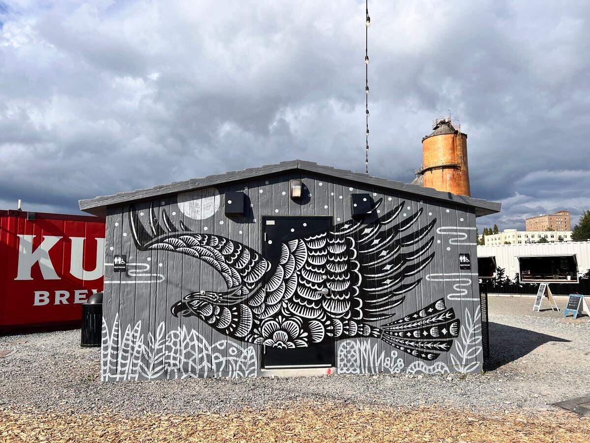 Shogo Ota of Camano Island painted a black and white bird at The Portal Container Village restrooms along the waterfront in Bellingham, Wash.