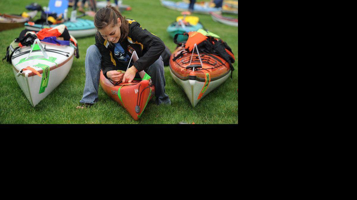 Melinda Trammell, of team Pride of Peak 7, adjusts the number on the bow of her kayak before the last leg of the 2010 Ski to Sea Race Sunday, May 30, 2010, which started at Zuanich Point Park in Bellingham.