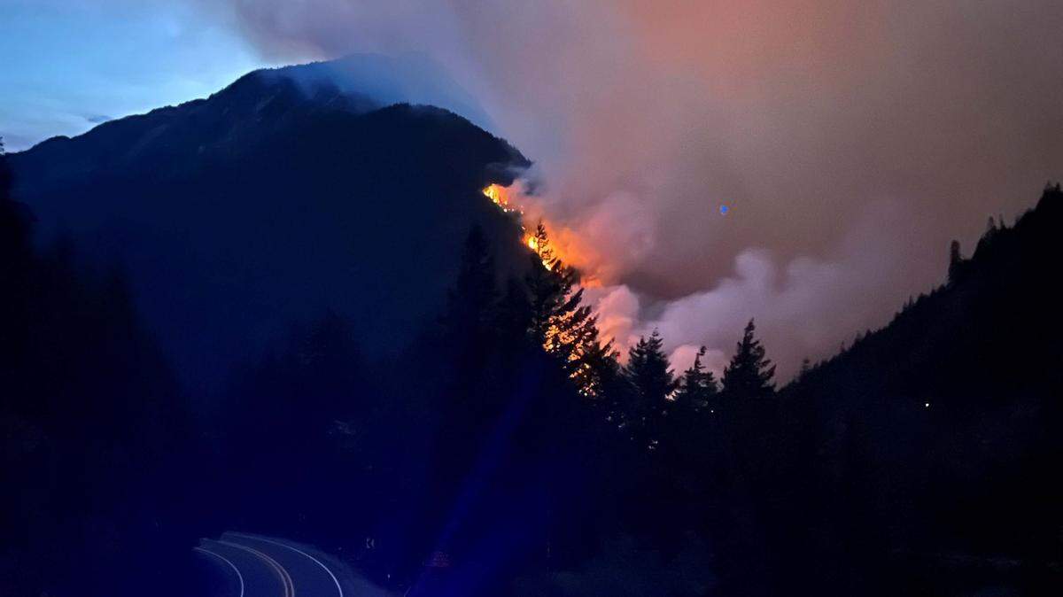 A Whatcom County sheriff’s deputy took this photograph of the Sourdough Fire burning near the North Cascades Highway on Sunday night, Aug. 6. Also called Highway 20 or SR 20, the road was closed for several days for the safety of firefighters and their equipment.