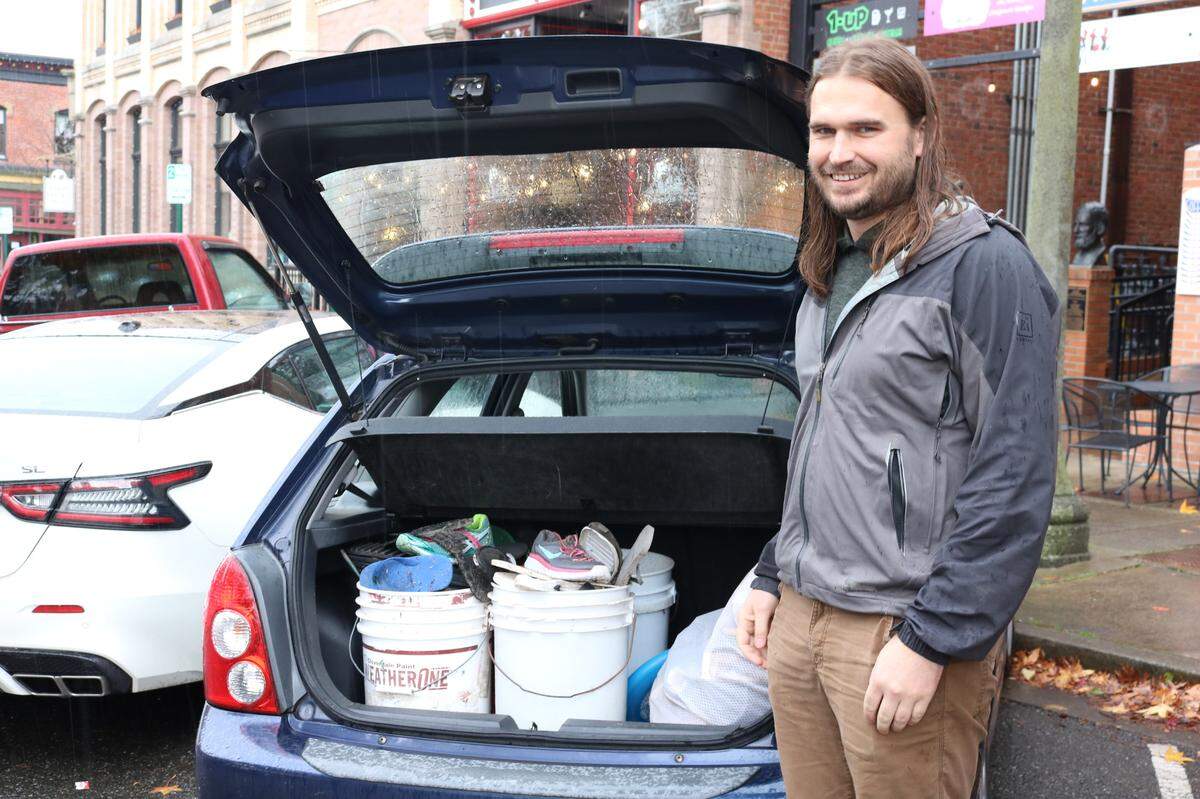 Ferndale resident and Trashy Greetings co-founder Greg Dayley stands next to his car in Bellingham on Friday, Nov. 12. Dayley picks up trash almost every week where the Nooksack River meets Bellingham Bay.