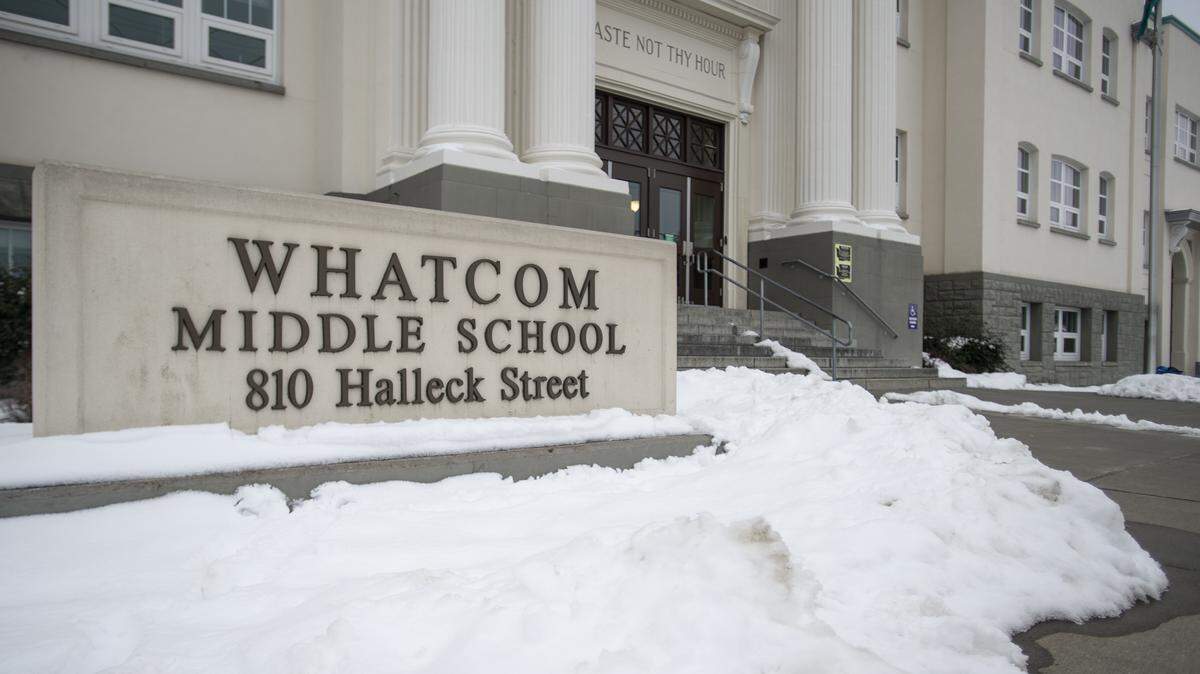 Snow sits on the ground around the front entrance to Whatcom Middle School in Bellingham on Thursday. Classes are canceled for Friday.