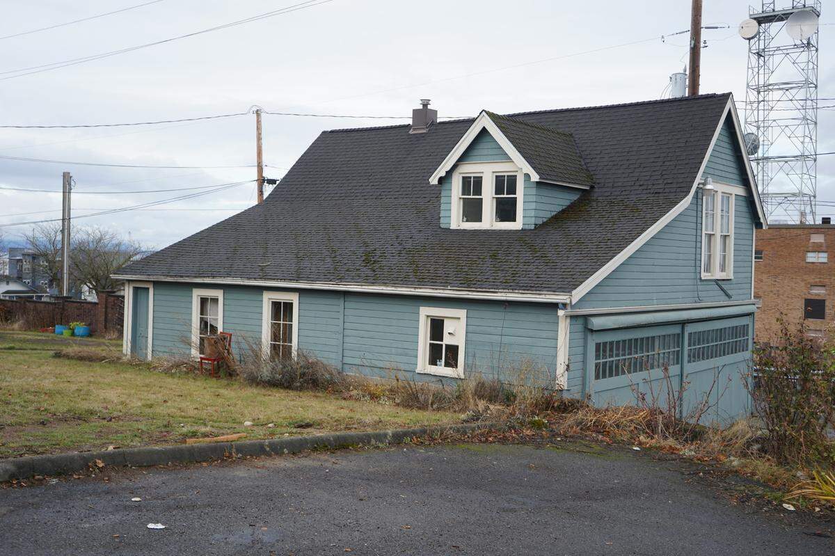The J.J. Donovan rear carriage house sits behind the main J.J. Donovan house on an alley way on Thursday, Dec. 8, in Bellingham. It has a living space above and a garage space below.