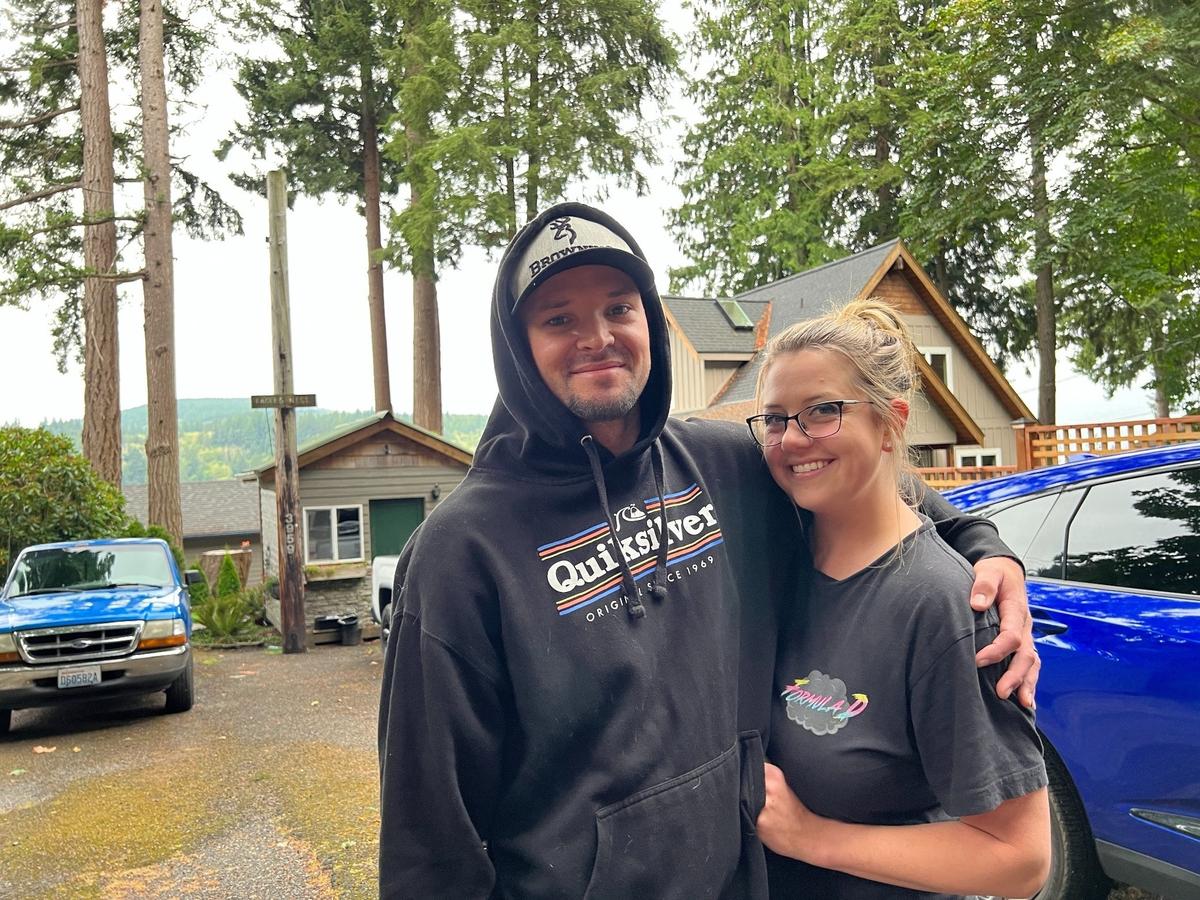Derek and McKenna Hinton discuss their plans for evacuation outside their Blue Canyon Road home along the Lake Whatcom shore on Tuesday.