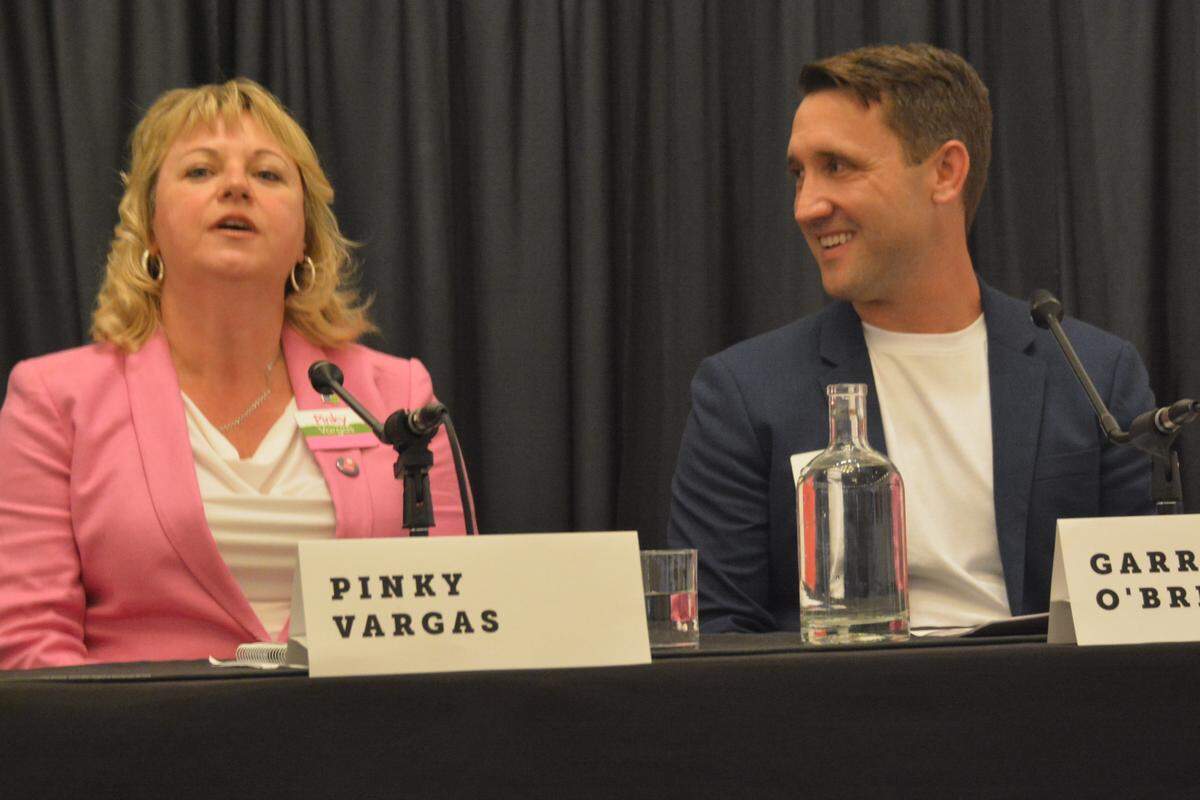 Bellingham City Council member Pinky Vargas, left, and home builder Garrett O’Brien, who are running for Bellingham mayor, chat before a June 19 candidate forum sponsored by the Downtown Bellingham Partnership at the Whatcom Museum.
