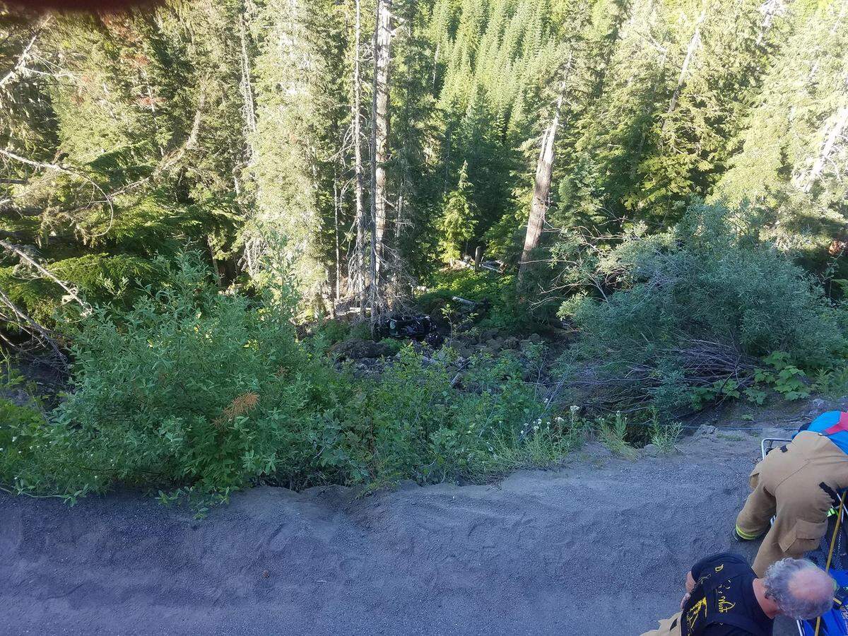 Whatcom County Fire crews from districts 19 and 14 rescue two occupants of a Honda Civic that left the Mount Baker Highway near milepost 51 and fell nearly 150 feet on Saturday. Neither occupant suffered any serious injuries.