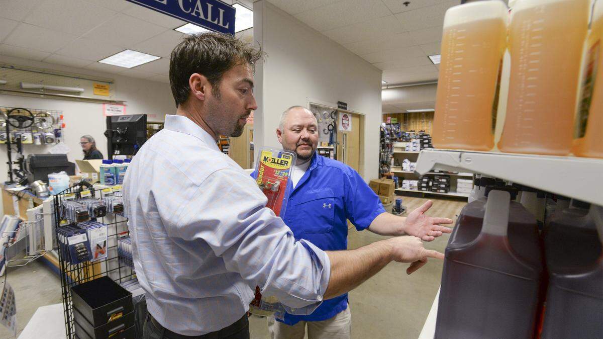 Customer Bill Havland, left, talks with LFS Marine store manager Jeff Wanlin at the store on Coho Way in Bellingham. Earlier this month the company sold its glove division to Safety Supply Corporation.