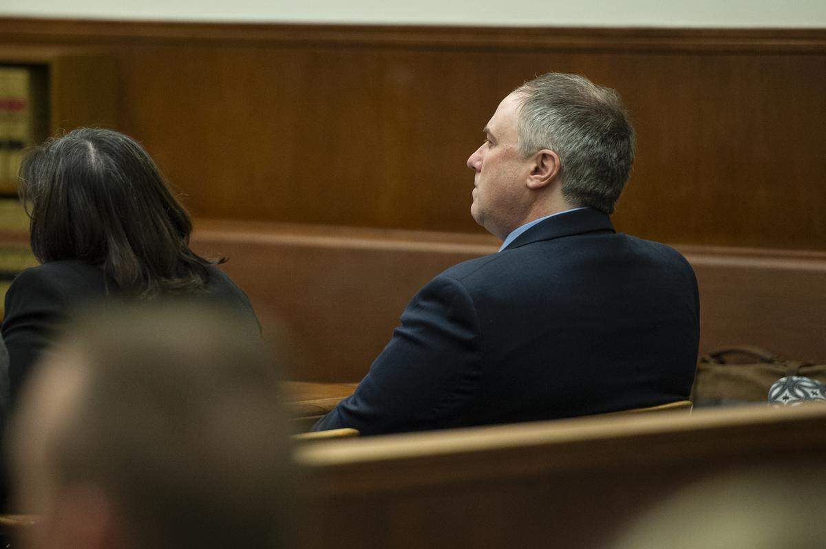 Timothy Forrest Bass, 51, looks on as Stephen Jackson, deputy public defender, makes his opening statement during Bass’ murder trial at Whatcom Superior Court in Bellingham on Friday.
