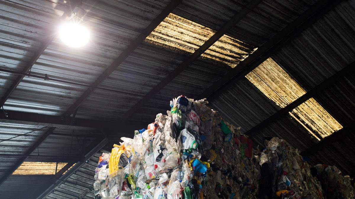 Stacks of plastic bales sit in a warehouse at Northwest Recycling, Inc. on Wednesday, June 13, in Bellingham. Nooksack Valley accepts bottles only as plastic recycling. SSC accepts them as well as jugs, caps, rings, cups, jars, tubs, pails, buckets and lids of all colors and numbers.