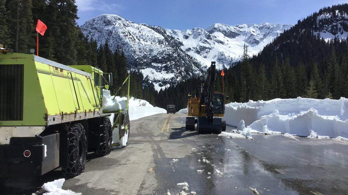 Washington State Department of Transportation crews clearing the North Cascades Highway from the east and west sides meet at Rainy Pass in 2022.