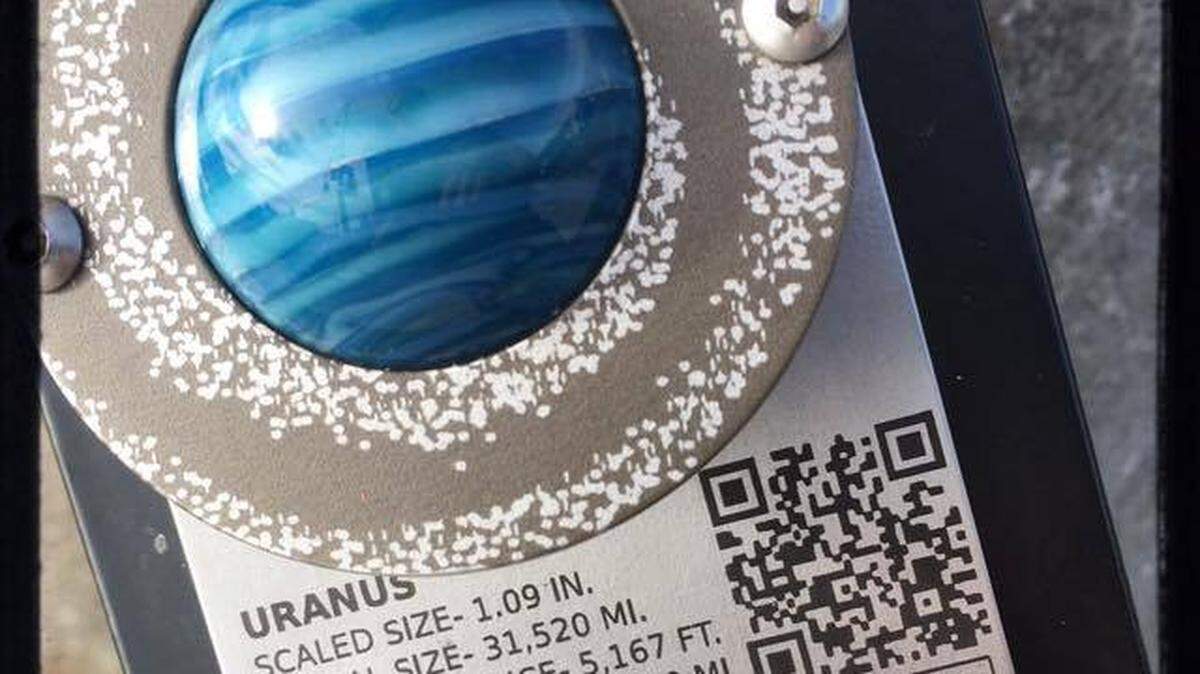 A marble fashioned to resemble the planet Uranus was mounted on a pedestal near North State and East Chestnut streets in downtown Bellingham in 2016 as part of a STEM art project called “The State of the Solar System.”