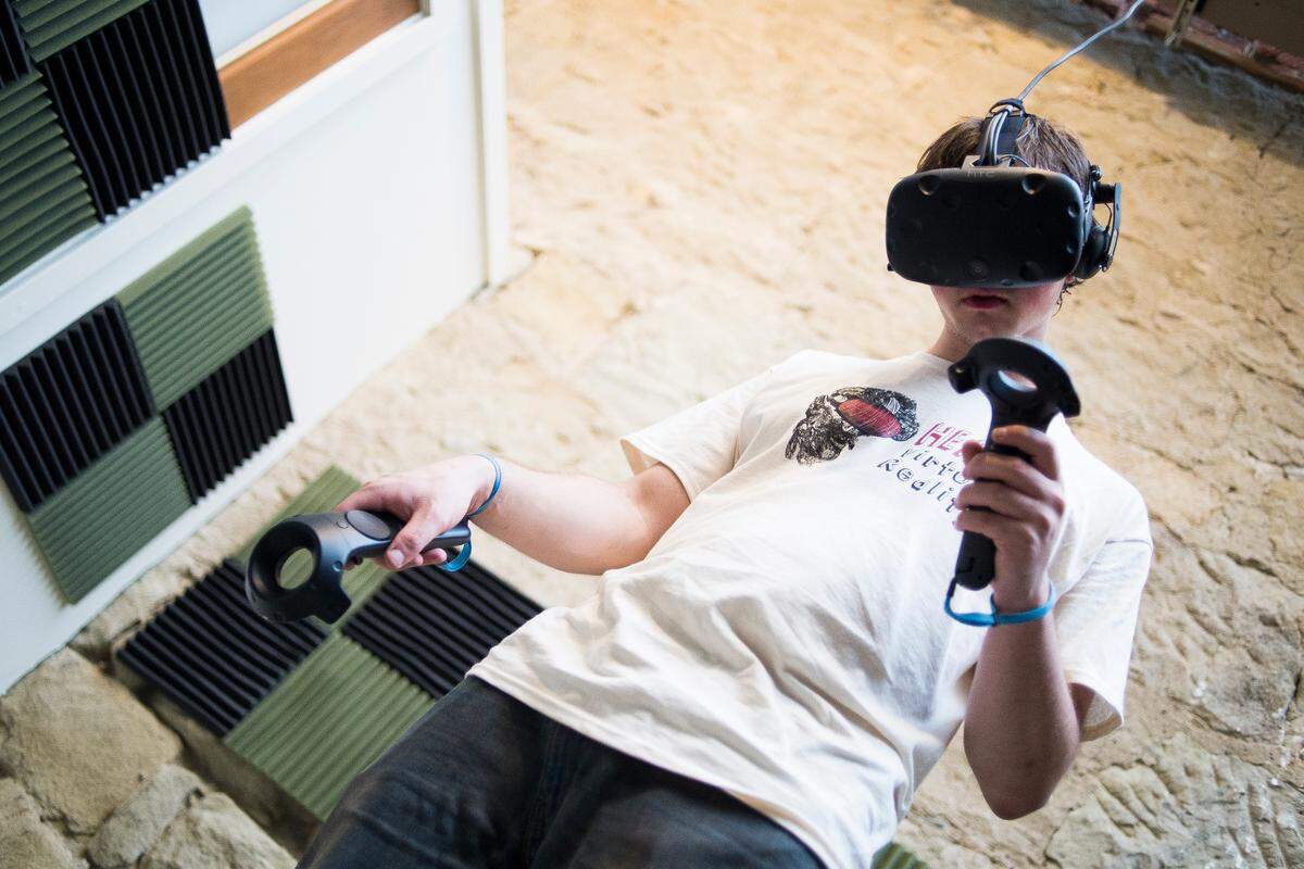Coulter Row plays a virtual reality game at Heady Virtual Reality on Thursday in Bellingham. Heady Virtual Reality is Bellingham’s first virtual reality arcade.