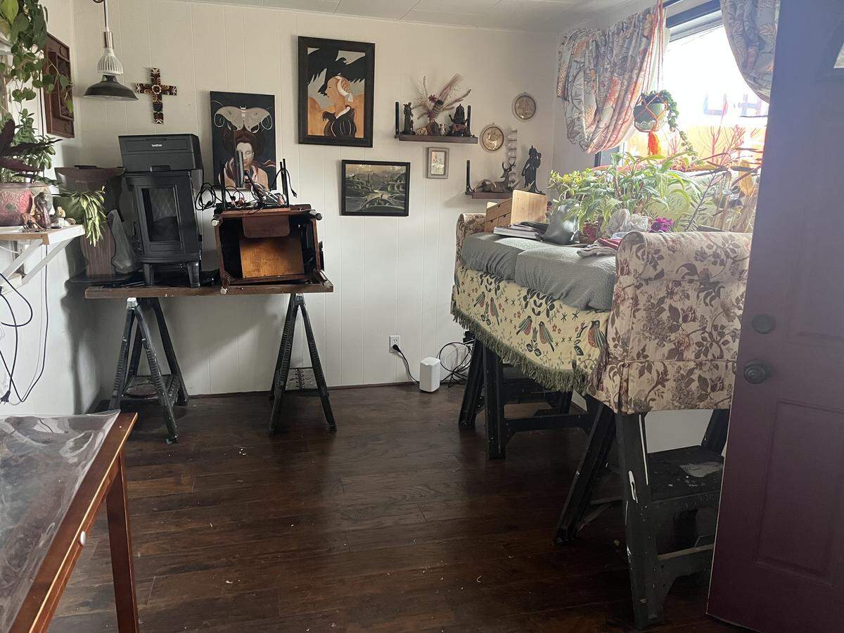 The inside of Charlette Seaver’s house was ready to take on floodwaters on December 11, 2025, in Ferndale, Wash. She propped up all of her belongings on tables and sawhorses to prevent them from getting water damage.