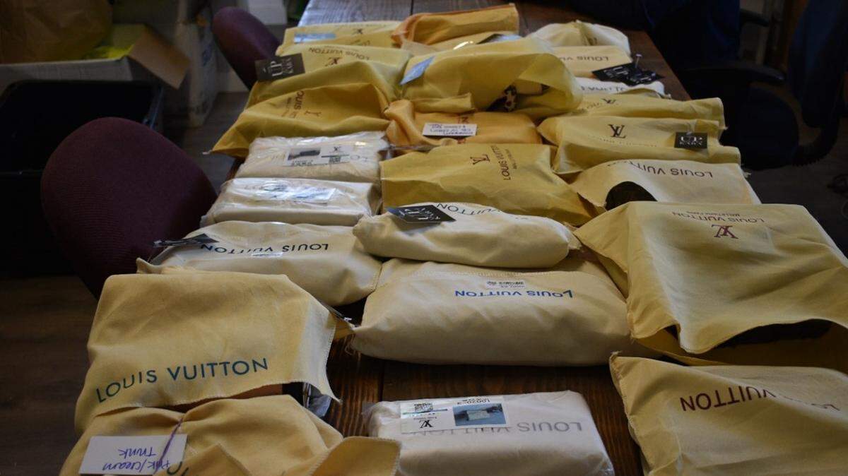 A Ferndale woman has been indicted by a federal grand jury for multiple counts of trafficking in counterfeit goods including designer handbags, wallets and jewelry.