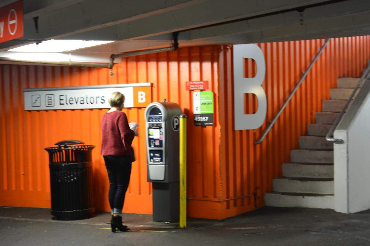 Cindy Gunderson of Lynden pays for parking Friday at the Commercial Street Garage.