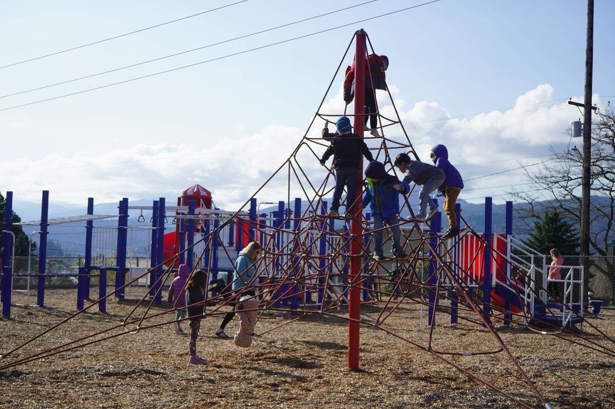 Children play at the Silver Beach Elementary School playground Friday, April 14, 2023, in Bellingham, Wash. The playground is expected to be replaced with an inclusive playground by the 2023-2024 school year.